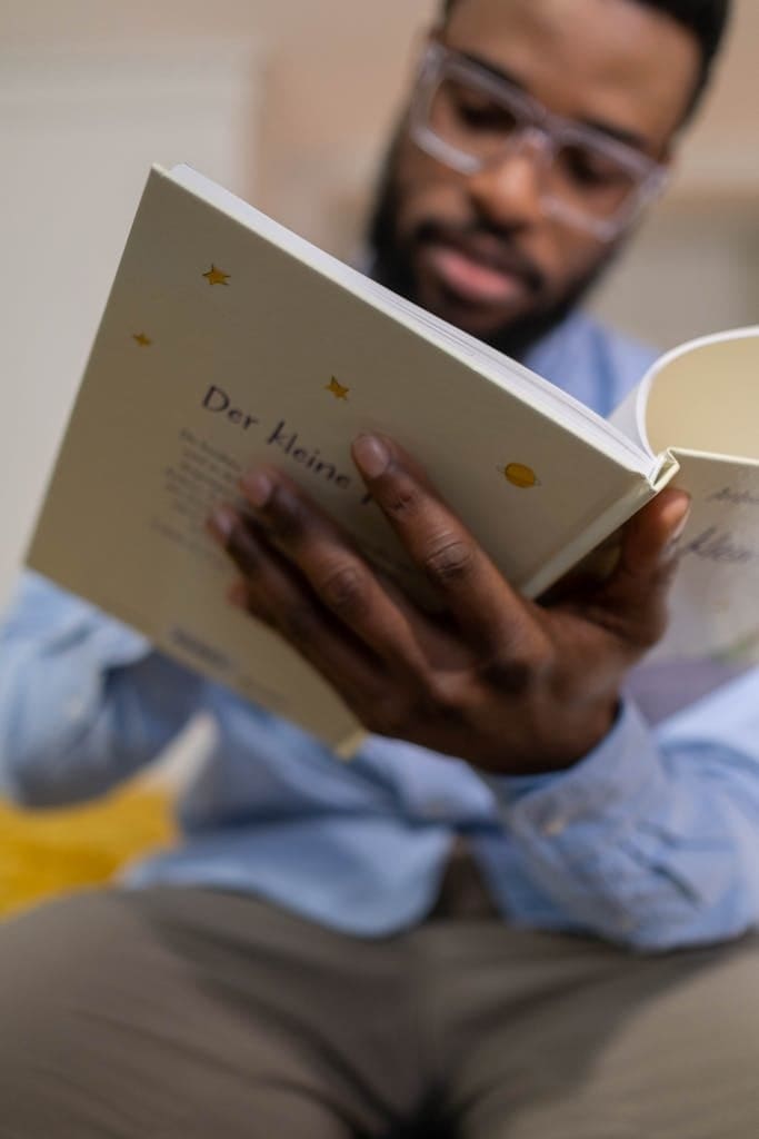 Man with Eyeglasses Reading a Book for storytelling