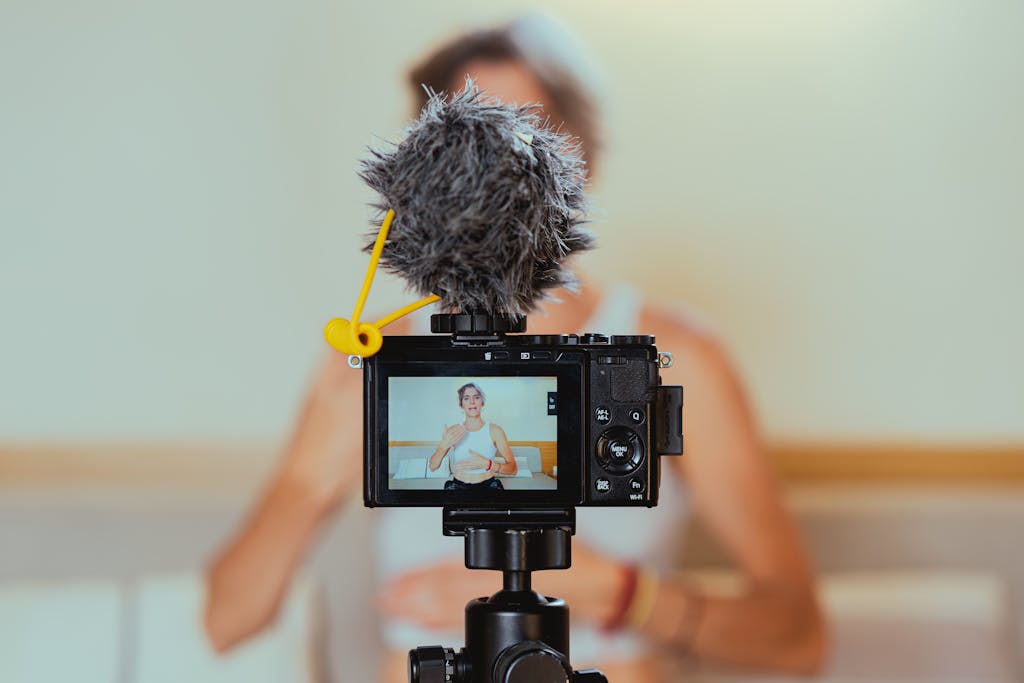 Shallow Focus Photo of a Video Camera Recording an Elderly Woman for influencer marketing